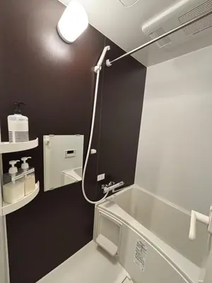 a bathroom with a tub and a sink and a mirror at Opening SALE! Stylish Room in Meguro Near Shibuya! in Tokyo