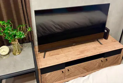 a large flat screen tv on a wooden entertainment center at Opening SALE! Stylish Room in Meguro Near Shibuya! in Tokyo