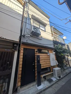 a house with a door on the side of it at MSTAY\u6771\u5411\u5cf6one in Tokyo