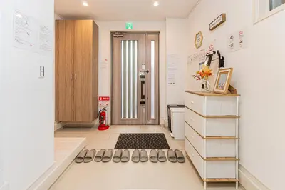 a room with a hallway with a door and a floor at Newly Built 4-Bedroom House in Shopping Street, 8-Min Walk from Akabane Station in Tokyo