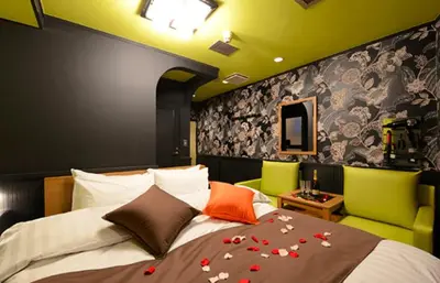 a bedroom with a bed with flowers on it at Shibuya center-350m in Tokyo