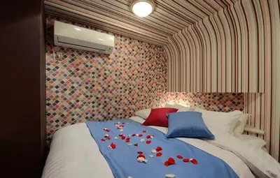 a bedroom with a bed with red roses on it at Shibuya center-350m in Tokyo