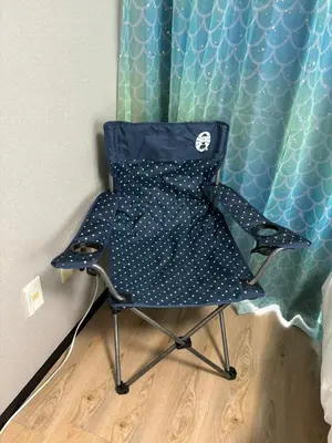 a blue chair sitting in front of a curtain at Direct to Narita 9min walk from Kinshicho St Within walking distance of Asakusa and Skytree 50min bus ride to Disneyland 3min walk from the mall in Tokyo