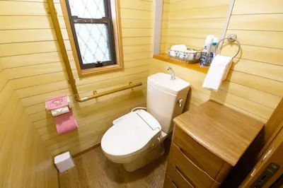 a small bathroom with a toilet and a window at Peace House in Tokyo