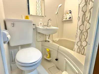 a small bathroom with a toilet and a sink at ShinjukuCityStay 502 in Tokyo