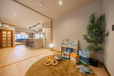 a living room with a table with toys on the floor at 200 m2 Modern Japanese style private 6LDK House in Tokyo
