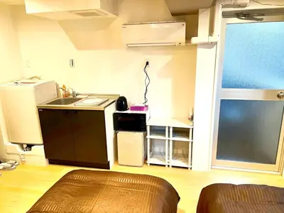 a small kitchen with a sink and a counter at Tokyo Meguro Bee House in Naka-Meguro in Tokyo