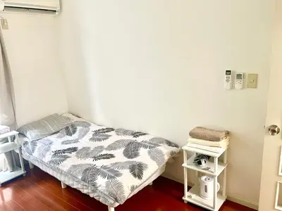 a small room with a bed in a room at Tokyo Meguro Bee House in Naka-Meguro in Tokyo