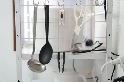 a rack with utensils hanging on a wall at 3min walk to Asagaya Sta, Cozy Private Studio Direct access 8min to Shinjuku, 30min to Akihabara and Asakusa in Tokyo