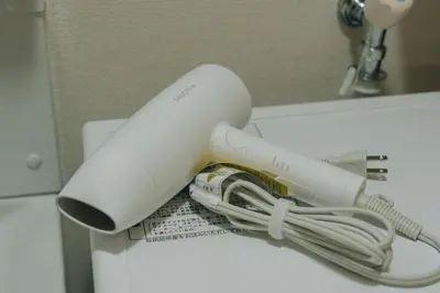 a wii remote sitting on top of a sink at Tokyo Nest Ohana in Tokyo