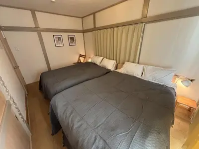 a bedroom with two beds in a room at Tokyo Nest Ohana in Tokyo