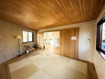 a large room with a wooden ceiling and a hallway at Opening in December Riverside stay to Akihabara Shinjuku in Tokyo