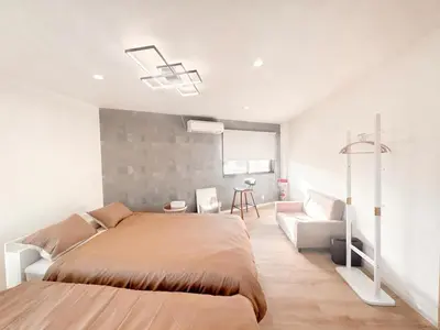 a bedroom with a large bed and a couch at Opening in December Riverside stay to Akihabara Shinjuku in Tokyo