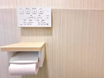 a toilet paper dispenser on a wall in a bathroom at 301, 6 min walk to subway stn, Tokyo Univ, Tokyo Tower, Tokyo-Dome direct by subway in Tokyo