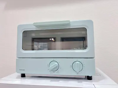 a white toaster oven sitting on top of a table at 301, 6 min walk to subway stn, Tokyo Univ, Tokyo Tower, Tokyo-Dome direct by subway in Tokyo