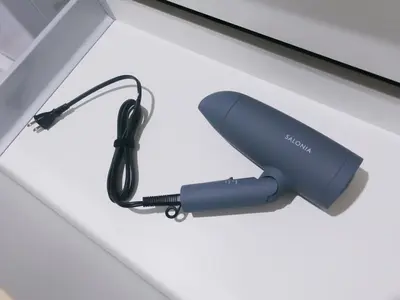 a hairdryer on a white table with aimeter at Group Friendly - Prime 3BR - Great Location & Rooftop in Tokyo