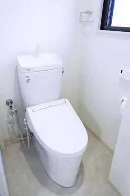 a bathroom with a white toilet in a room at Group Friendly - Prime 3BR - Great Location & Rooftop in Tokyo