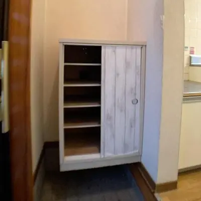 a cabinet in the corner of a kitchen at Nekoones Shinkoiwa 1F-\u30cd\u30b3\u30ef\u30f3\u30ba\u65b0\u5c0f\u5ca91F in Tokyo