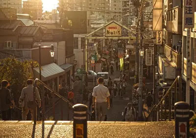 a group of people walking down a city street at APA Hotel Ueno Ekikita in Tokyo