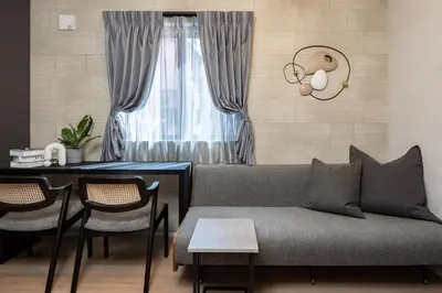 a living room with a couch and a table at Bijou Suites Zephyr in Tokyo