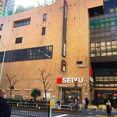 a building with a sign on the side of it at Tokyo Ikebukuro apartment near Pokemon Center in Wada