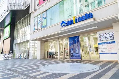 a large building with a sign on the side of it at Tokyo Ikebukuro apartment near Pokemon Center in Wada
