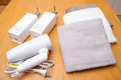 a table with two nintendo wii controllers on it at Tokyo Ikebukuro apartment near Pokemon Center in Wada