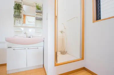 a bathroom with a sink and a shower at Tokyo Ikebukuro apartment near Pokemon Center in Wada