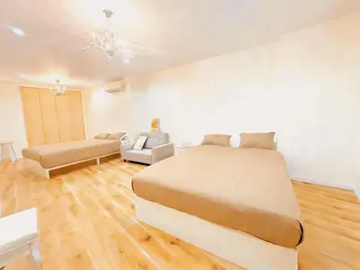 a bedroom with a large bed and a couch at Opening in December ,Riverside stay,to Narita Airport ,Shinjuku in Tokyo