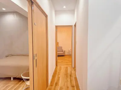 a hallway leading to a bedroom with a bed at Opening in December ,Riverside stay,to Narita Airport ,Shinjuku in Tokyo