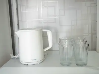 a white blender and two glasses on a counter at Opening in December ,Riverside stay,to Narita Airport ,Shinjuku in Tokyo