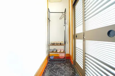 a hallway with a shower in a room with windows at Takara Entire Japanese house with a view of the shrine in Tokyo