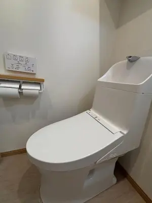 a bathroom with a white toilet in a room at Wing Stay in Tokyo
