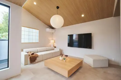a living room with a couch and a table at Ebisu2 Lux Villa 6 min Shibuya 4min Ebisu in Tokyo