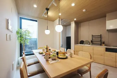 a kitchen and dining room with a table with food on it at Ebisu2 Lux Villa 6 min Shibuya 4min Ebisu in Tokyo