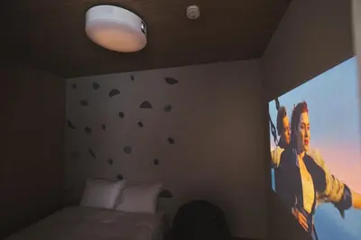 a bedroom with a large poster on the wall at Ebisu2 Lux Villa 6 min Shibuya 4min Ebisu in Tokyo