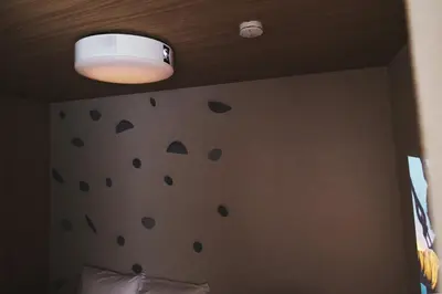 a bedroom with a wall with polka dots on it at Ebisu2 Lux Villa 6 min Shibuya 4min Ebisu in Tokyo