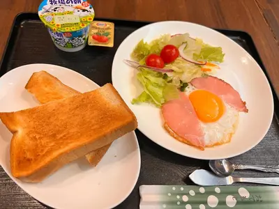a tray with two plates of food with a sandwich and salad at Kuretake-Inn Tokyo Funabori in Tokyo