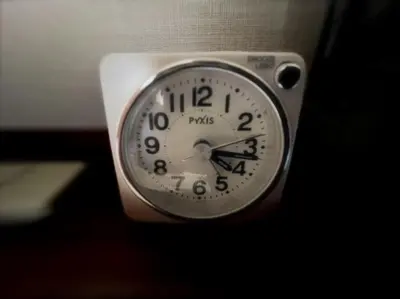 a clock sitting on top of a table at Kuretake-Inn Tokyo Funabori in Tokyo