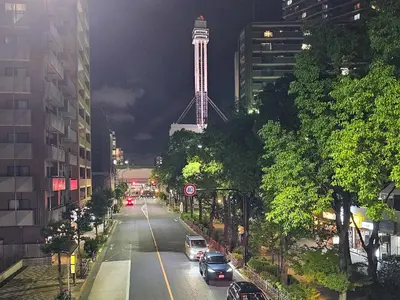 a view of a city street with a tower at night at Kuretake-Inn Tokyo Funabori in Tokyo