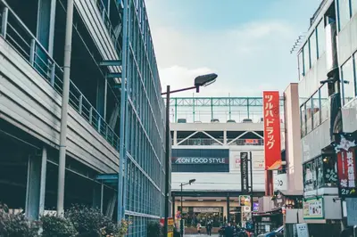 a busy city street with buildings and a stadium at Kuretake-Inn Tokyo Funabori in Tokyo