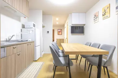 a kitchen and dining room with a table and chairs at Featured Japanese Culture Hut Experience Tokyo's Local Life in a Two-Story Detached B&B in Tokyo