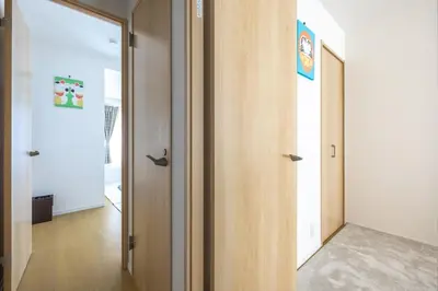 a hallway with two wooden doors and a hallway with at Featured Japanese Culture Hut Experience Tokyo's Local Life in a Two-Story Detached B&B in Tokyo