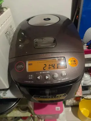 a toaster is sitting on top of a table at sakura\u306e\u5bb6 in Tokyo
