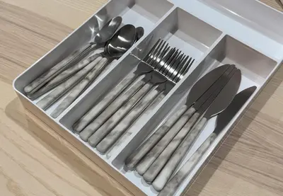 a plastic container with utensils in it on a table at Marble TOKYO Base Tabata 102 in Tokyo