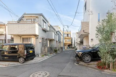 a car parked on the side of a street at Marble TOKYO Base Tabata 202 in Tokyo