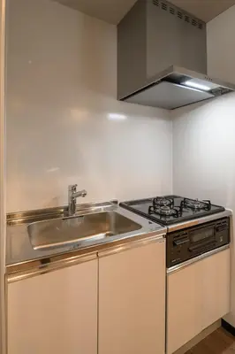 a kitchen with a sink and a stove at Ebisu City Stay 5F - \u6075\u6bd4\u5bff \u30b7\u30c6\u30a3\u30b9\u30c6\u30a4 5F in Tokyo