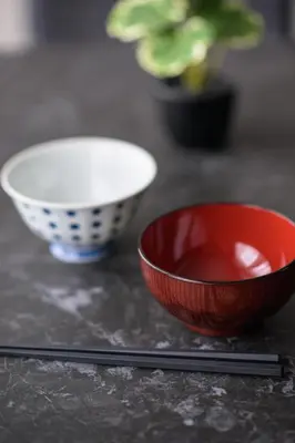 two bowls and chopsticks sitting on a table at Ebisu City Stay 5F - \u6075\u6bd4\u5bff \u30b7\u30c6\u30a3\u30b9\u30c6\u30a4 5F in Tokyo
