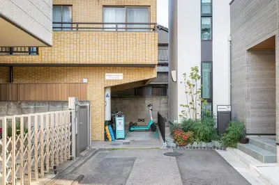 a brick building with a bike parked in front of it at Marble TOKYO Base Tabata 201 in Tokyo