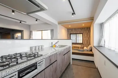a kitchen with a stove and a sink at Marble TOKYO Base Tabata 301 in Tokyo
